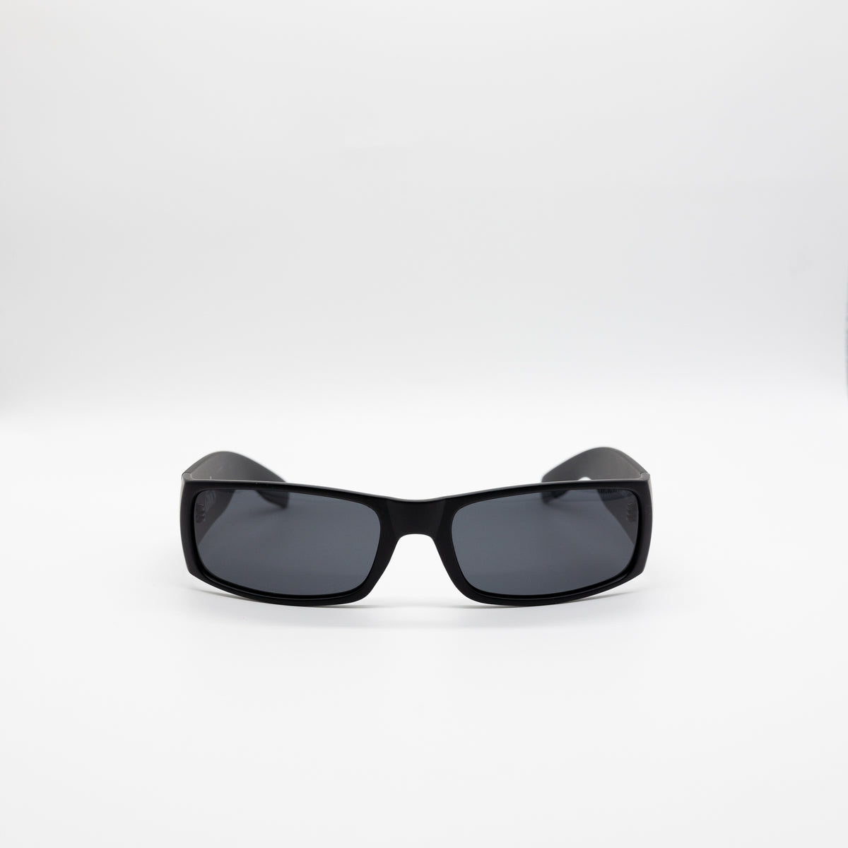 A pair of matte black sunglasses with gray polarized lenses, including a logo on the side, complete with a glasses pouch and cleaning cloth.